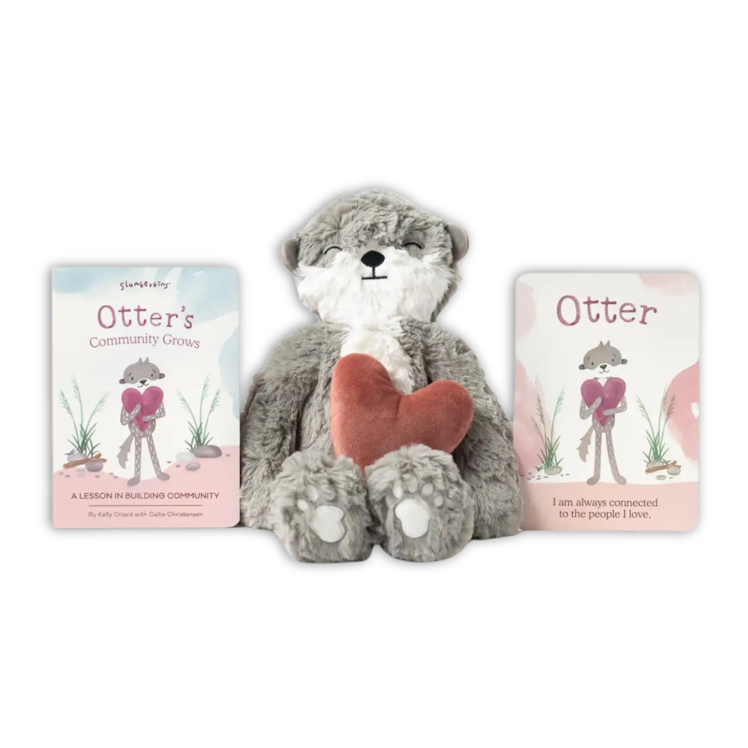 Pebble Otter Kin with a lesson book