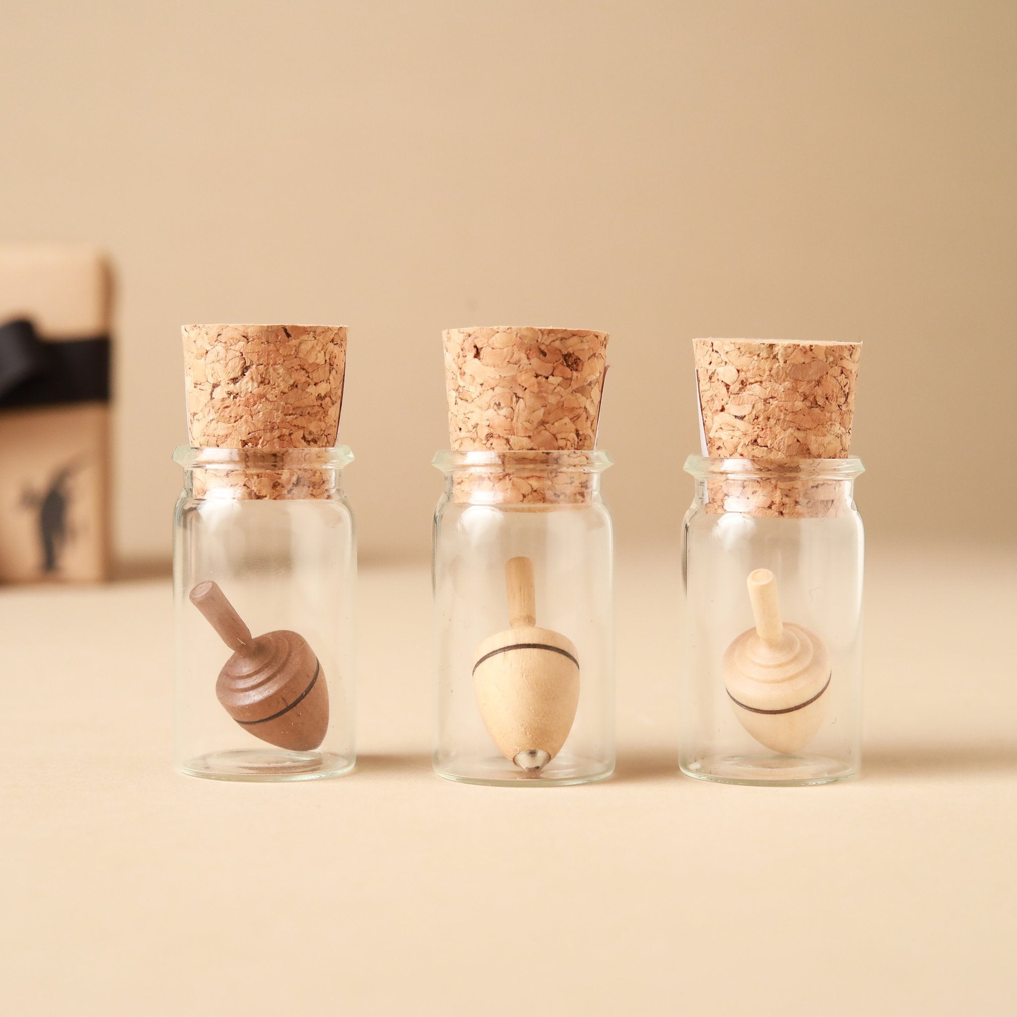 Mini Thunderbolt Wooden Spinning Top | Glass Display